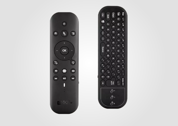 Black Zepp remote with its holder.
