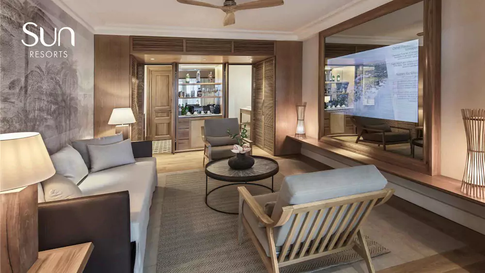 Living room with full-length wooden-framed mirror TV, white couch, and circle table at the center.