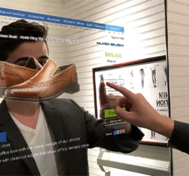 A man pointing at the screen of a unique mirror TV to order brown leather shoes online.